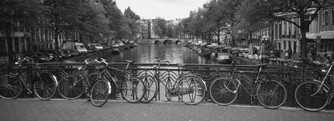 Bicycle Leaning Against A Metal Railing On A Bridge, Amsterdam, Netherlands