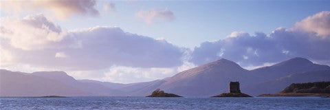 Castle at dusk with mountains in the background, Castle Stalker, Argyll, Highlands Region, Scotland