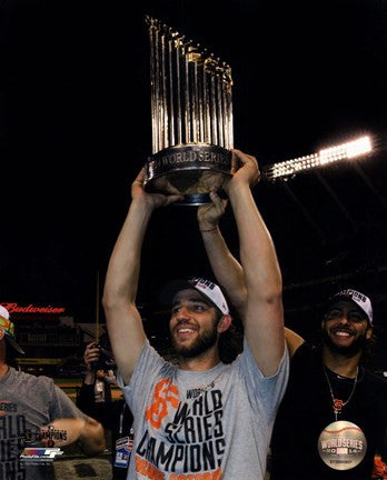 Madison Bumgarner with the World Series Championship Trophy Game 7 of the 2014 World Series